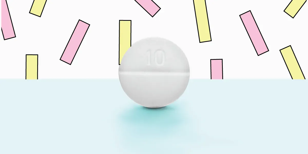 A single white pill on a pastel background