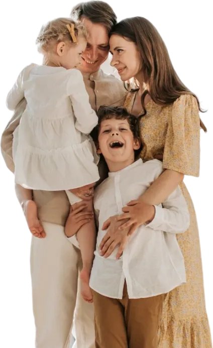 A smiling family of four hugging